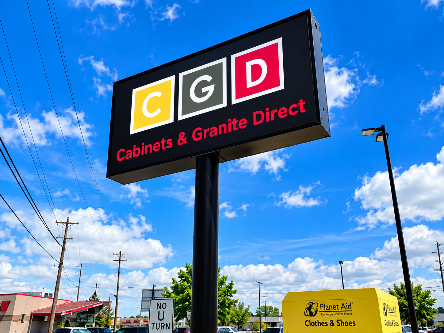 Cabinets and Granite Direct pole sign by BNext Design