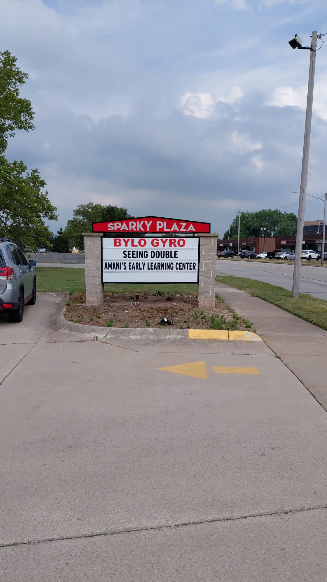 Sparky Plaza multi-tenant monument sign with brick columns by BNext Design
