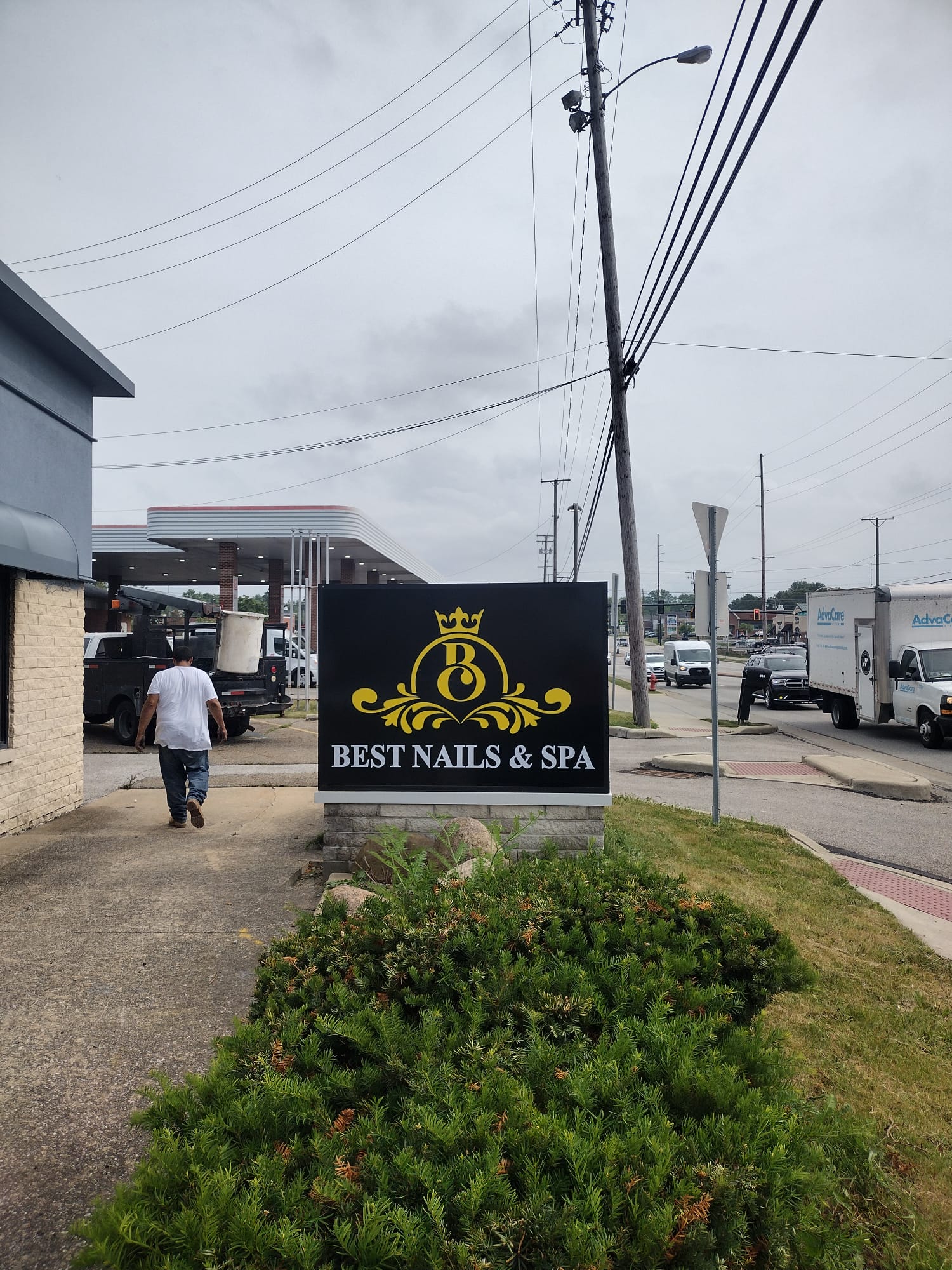 Best Nails & Spa black and gold monument sign on stone base by BNext Design