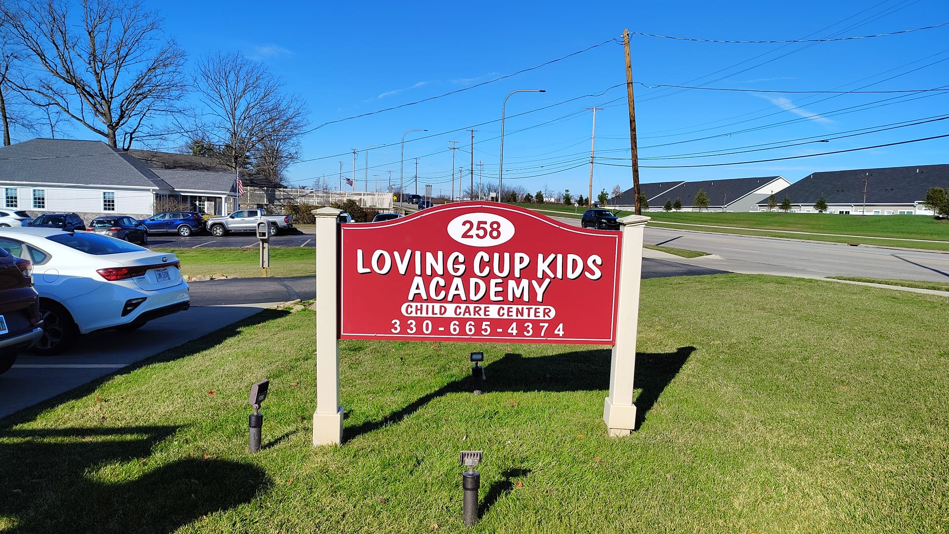 Loving Cup Kids Academy red post-and-panel monument sign by BNext Design