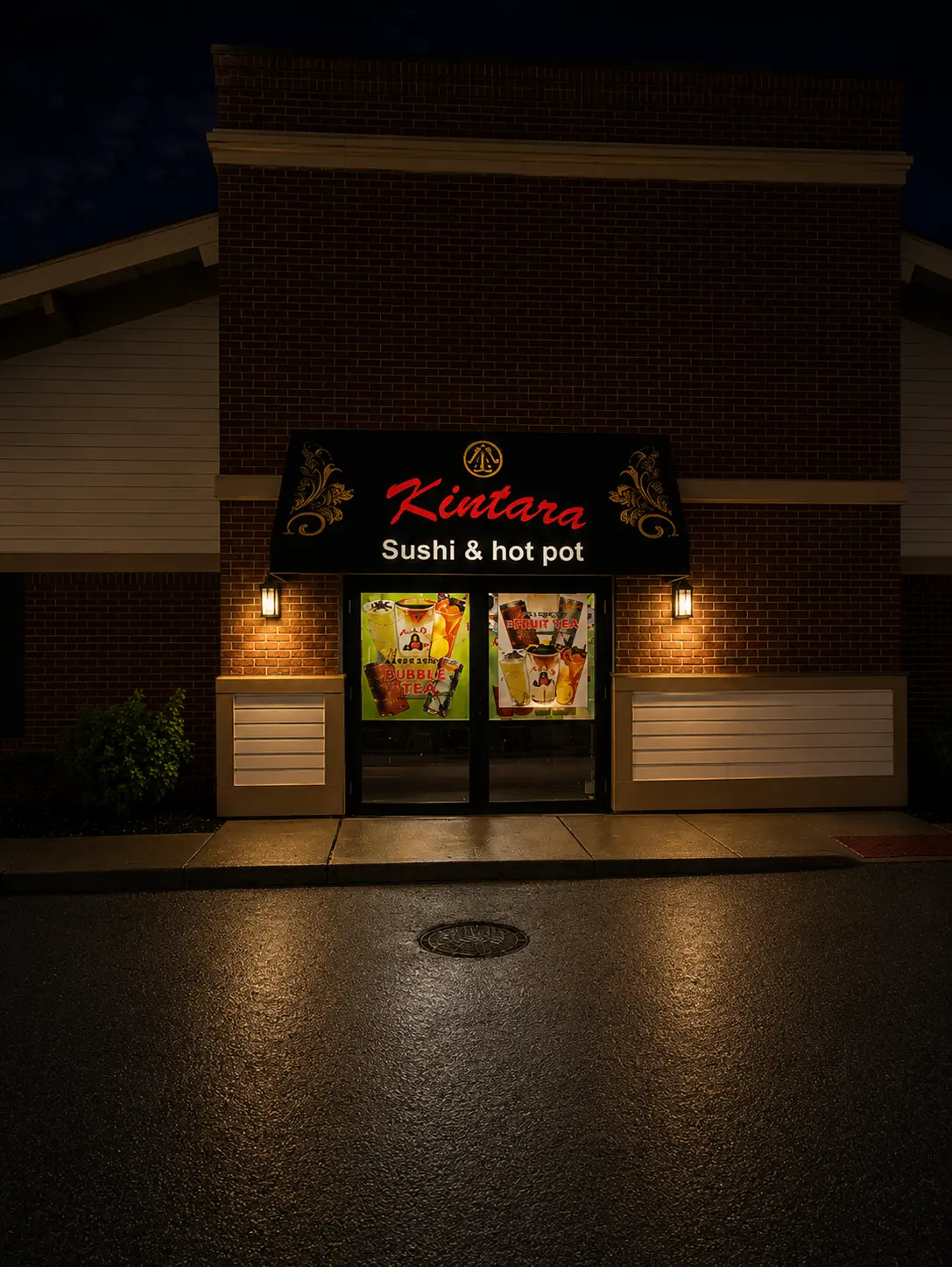 Restaurant storefront awning and signage at night